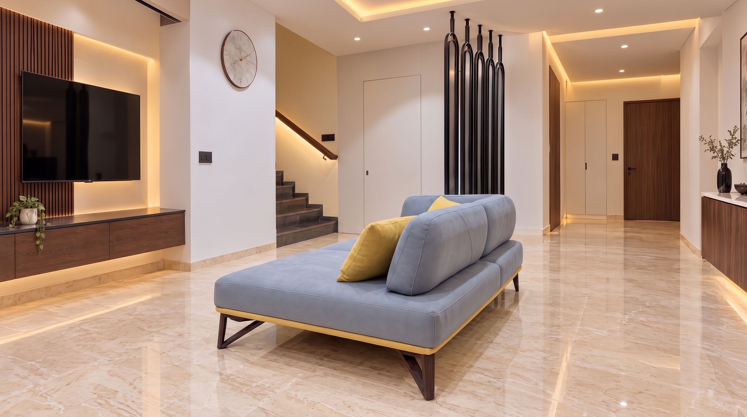 Living room with a low blue-grey sofa, mustard cushions and a black sculpted screen